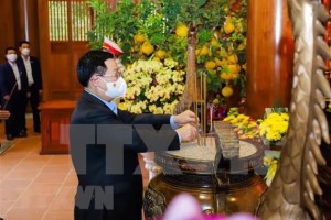 Offering incense in tribute to President Ho Chi Minh at Kim Lien relic site in central Nghe An province